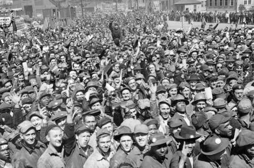 A. Aubrey Bodine's Photograph 'Workers Celebrate Triple Launching' Captures Historic Shipbuilding Moment