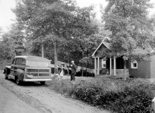 A. Aubrey Bodine's 'School Bus Stop (1952)' Captures Historic One-Room School Era