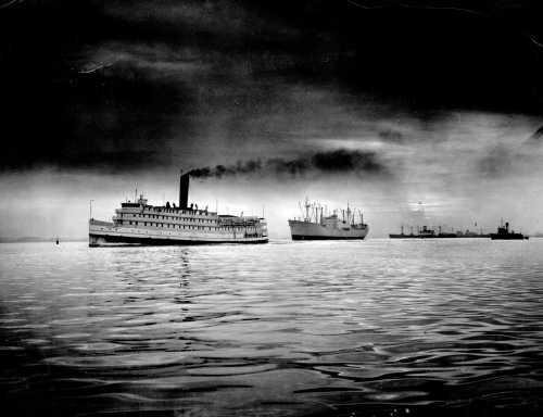 A. Aubrey Bodine's 'Steamboat and Freighter (1956)' Captures Maritime Precision